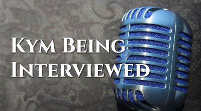 Kym-being-interviewed-mic-2345163_1920